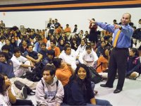 Animated principal, speaking to student body in gymnasium