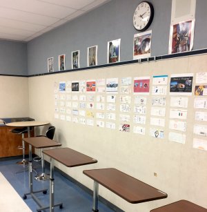 A line of standing desks against a classroom wall