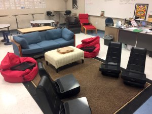 A classroom with flexible seating, like bean bag chairs and a couch.