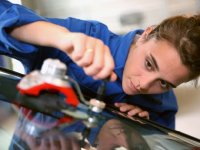 Girl working on an automobile