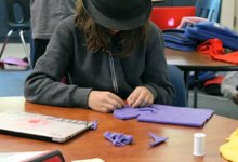 Student working on a puppet