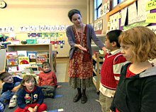 Two students standing in front of the class.