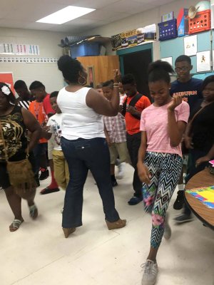 Sandreka Brown dances with students. 