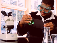 A photo of a high school student working in a chemistry lab.