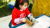Photo of girl doing woodworking