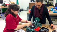 Photo of students working on robot