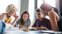 Students of different ethnicities work together in a group.