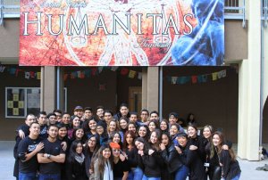 Students pose in front of their high school.