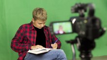 A student shapes a story with a script and video camera