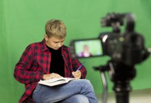 A student shapes a story with a script and video camera