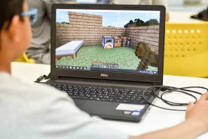 Photo of boy playing Minecraft game