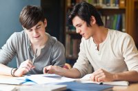 Two high school students annotating a text