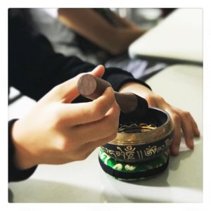 High school student using singing bowl.