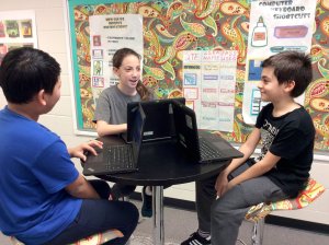 A group of students work on a project together at White Oak Elementary in Sugar Hill, Georgia.