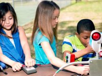 photo of young students working on a project