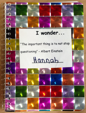Hannah's colorful sparkly journal with a cover sticker that says, I wonder . . . 'The important thing is to not stop questioning' --Albert Einstein, and then a line for the student's name