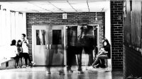 Image of students walking in a school hallway