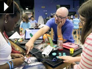 Jay Silver helps students create with the Makey Makey kit. 