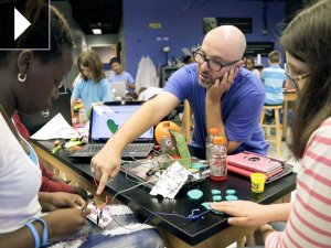 Jay Silver helps students create with the Makey Makey kit.