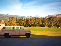 Hood River County School District van with the mountains and trees in the background