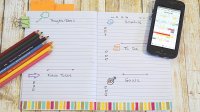 Image of a student’s open daily planner with colored pencils and smartphone calendar on the side
