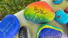 Photo of colorful rocks hand-painted by students