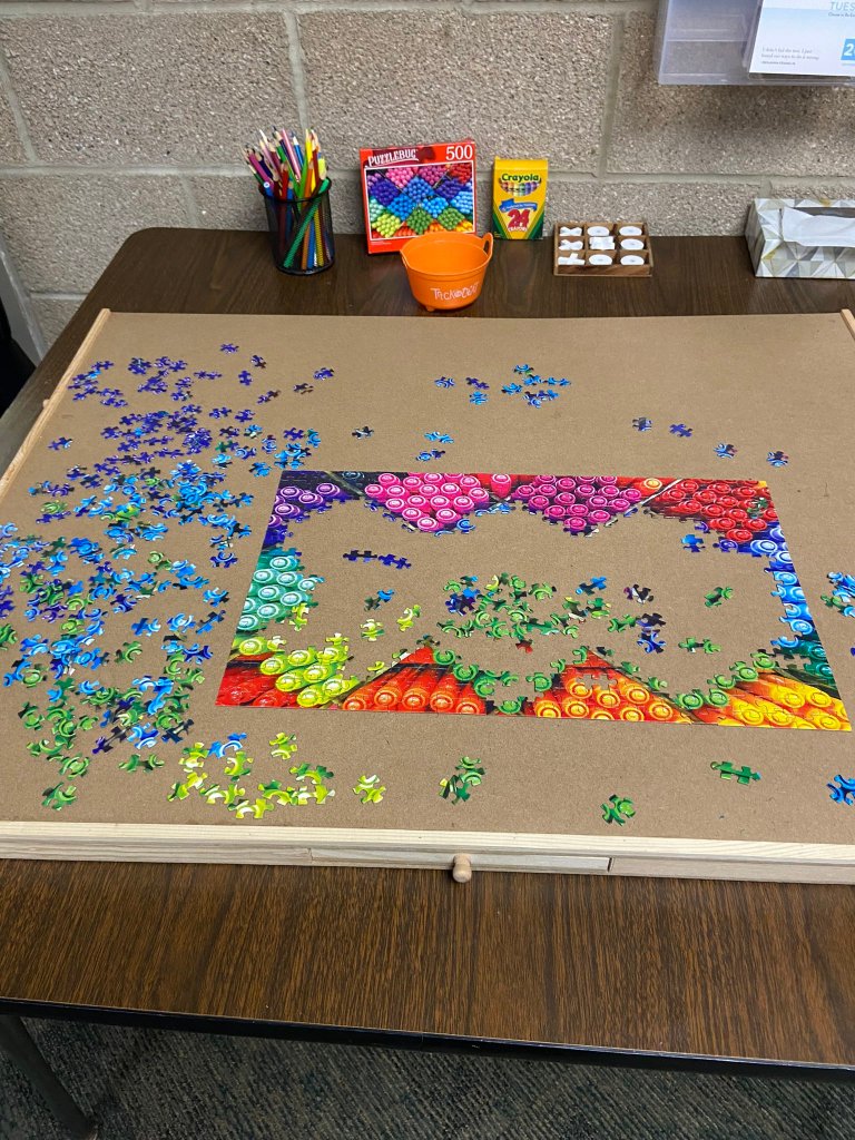 Photo of collaborative puzzle activity in school