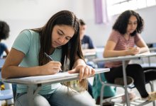 High school students writing at their desks
