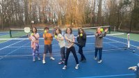 Photo of a group of kids on pickleball court