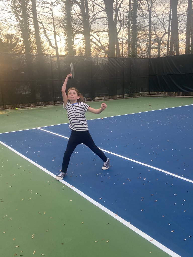 Photo of a child on pickleball court