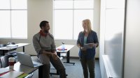 Photo of two teachers meeting in classroom