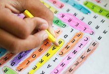 Child filling out a word search activity