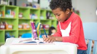 Elementary student works independently at his desk