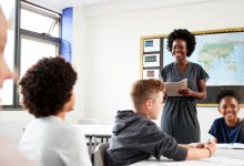 Photo of middle school teacher and students