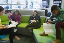 Teacher reading with a small group of elementary students