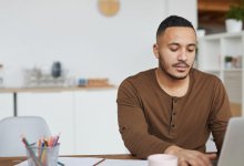 Photo of teacher on laptop at home