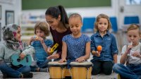 Elementary teacher and students playing a variety of instruments