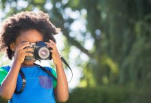 Photo of elementary student with camera
