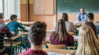 Photo of high school teacher and students in classroom