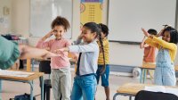 Elementary students dancing in class