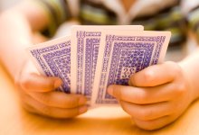 photo of playing cards in child's hands