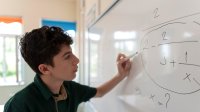 maths problem solving difficult Student working on math problems on a whiteboard