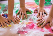 Photo of childrens' hands finger painting