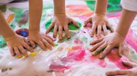 Photo of childrens' hands finger painting