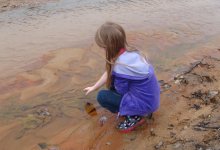 Young girl playing in the water