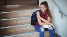 Student sitting on steps alone