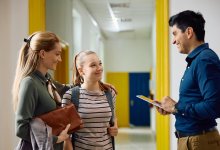 Teacher talking with parent and student