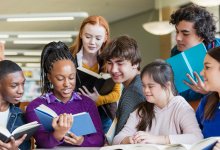 Group of students reading books together