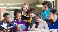 Group of students reading books together