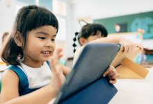 Elementary students using tablets in class